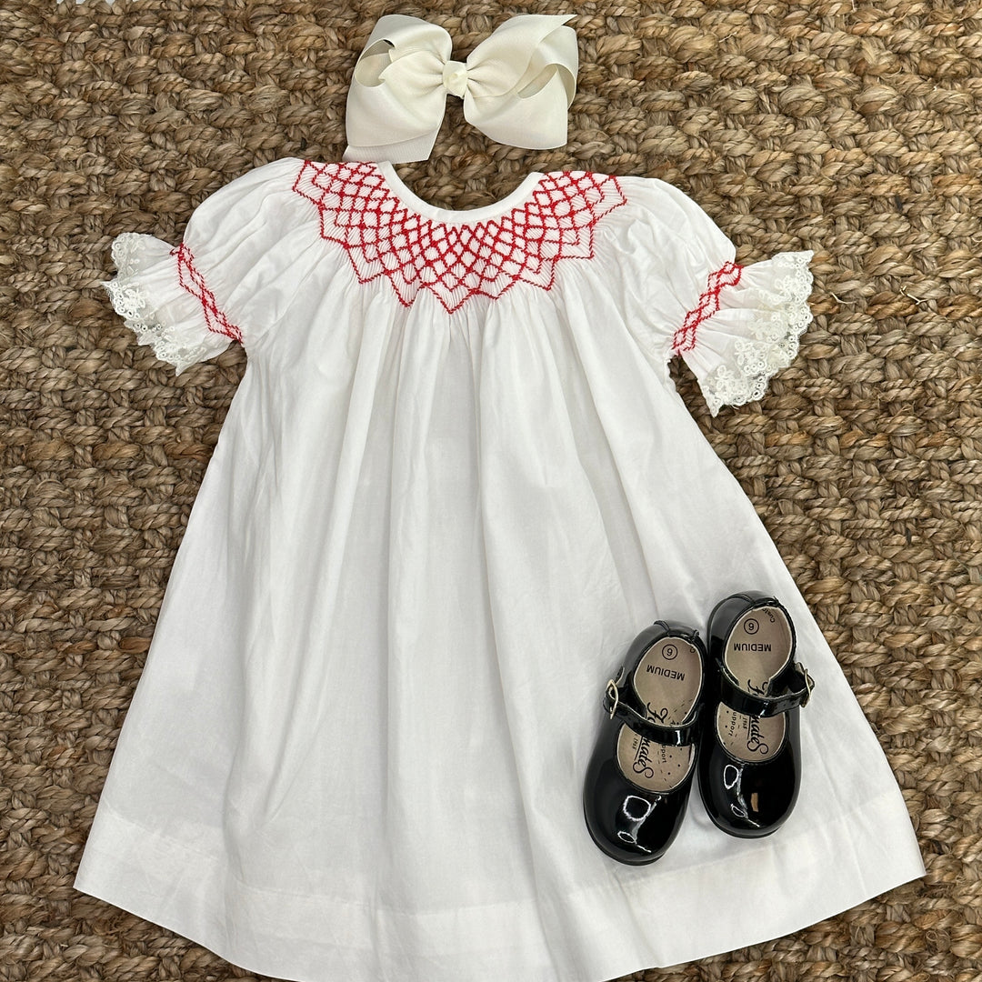 red and white smocked dress THE HARLOW STRIPED SMOCKED DRESS IN RED