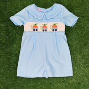 Pumpkin Smocked Shortall with Wagons on Blue