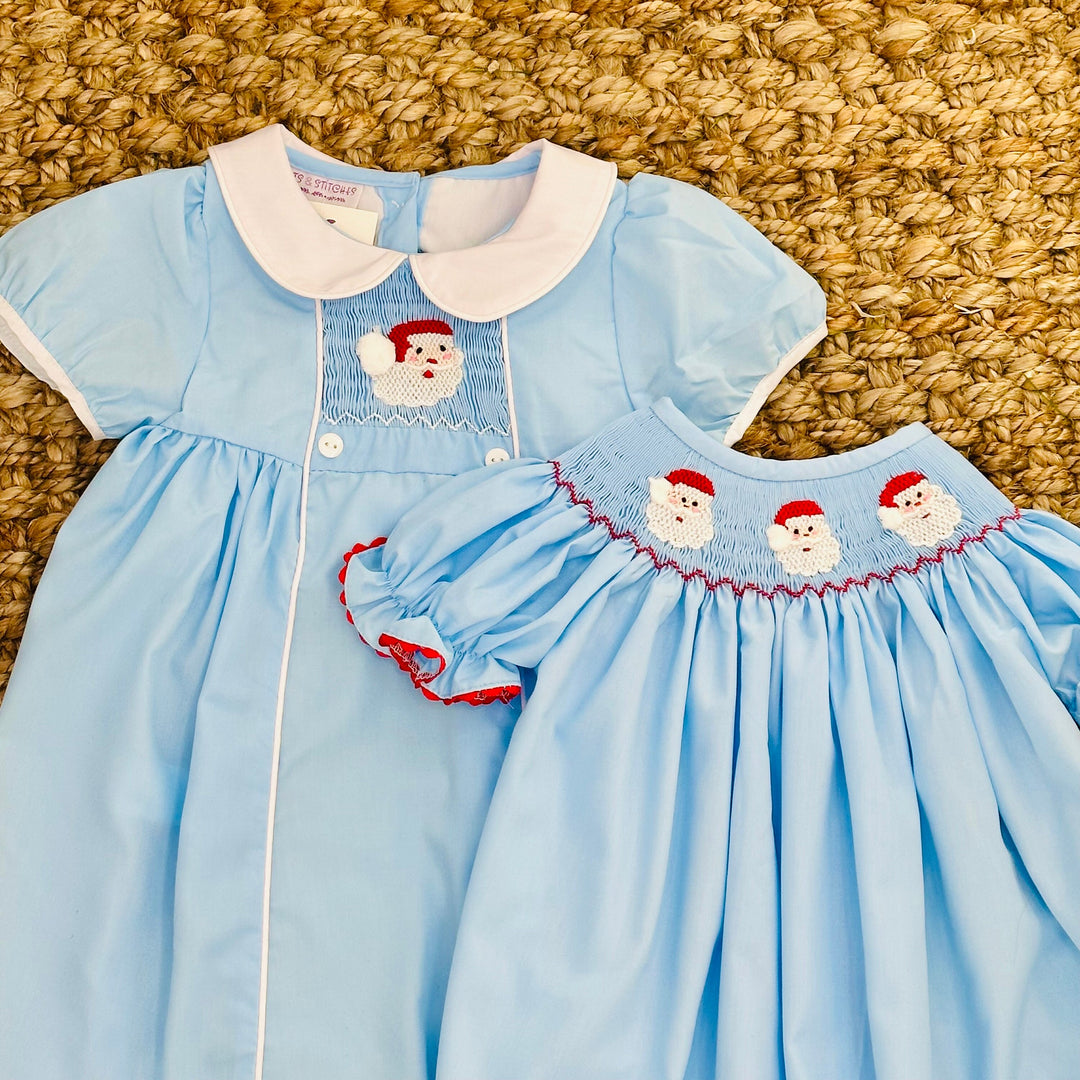 Santa Smocked Christmas Dress With Collar in Light blue Pleats and Stitches Santa Smocked Christmas Dress With Collar in Light blue Pleats and Stitches