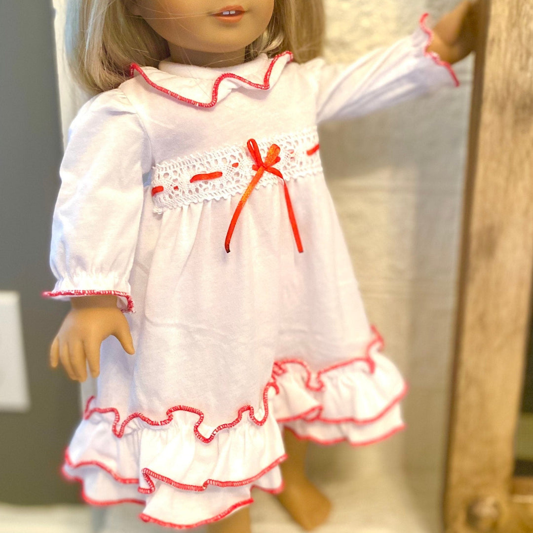 Matching Christmas Clara doll nightgown in white with red ribbon